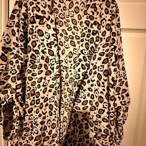 Open style Shirt jacket with button top sleeve and pockets on both sides.